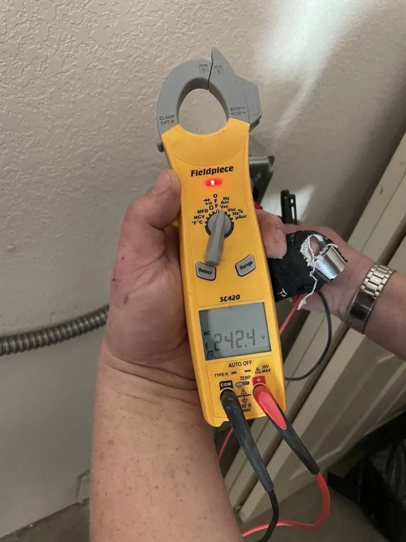 Voltage testing with clamp meter during Outlet Installation in Moraga
